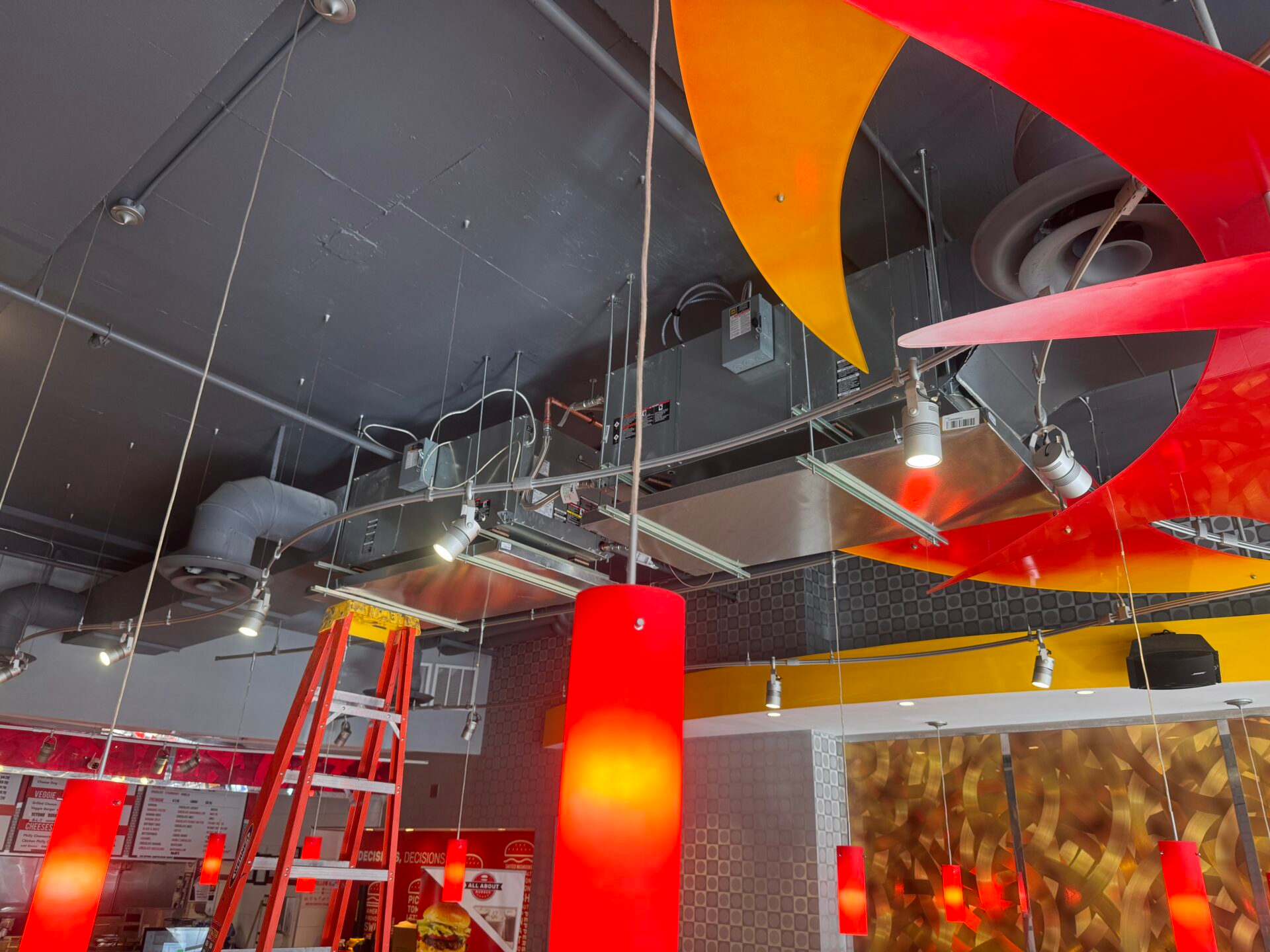 Commercial restaurant HVAC ductwork and ceiling air distribution system by Potomac HVAC and Mahdi Poursiami.